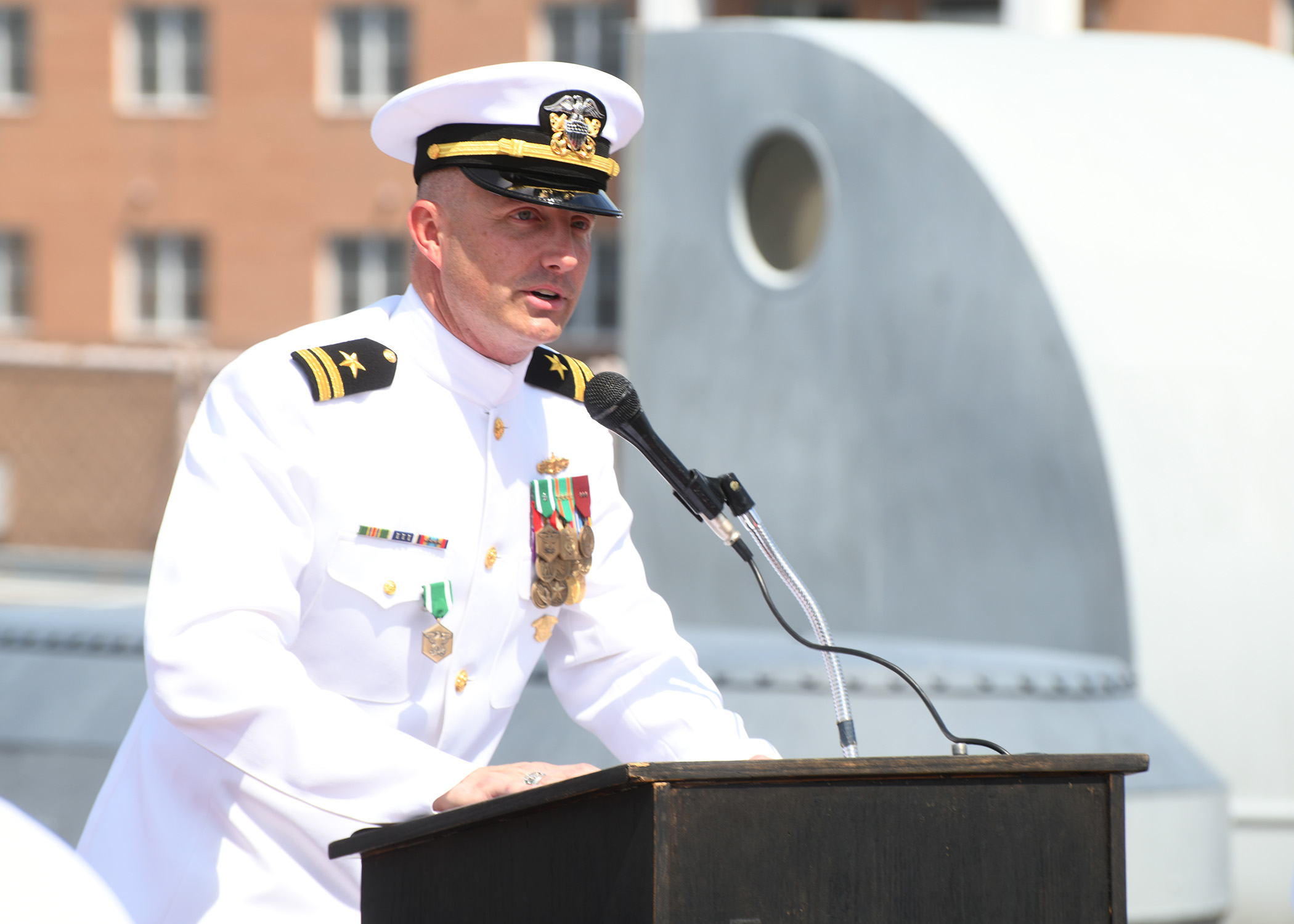 Michael Kennedy in Navy dress whites, representing 20 years of military leadership
